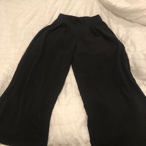 High waisted black pleated palazzo pants